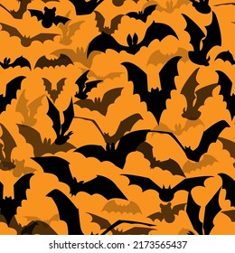 Seamless Halloween vector pattern with various flying bat silhouettes on orange background. Texture with flittermouses for packaging, postcards, parties, decor, web, fabric.
