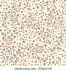 Seamless hand drawn background with blue red and yellow dots. fabric pattern, kids clothes design. pastel colors