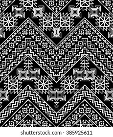 Seamless hand drawn chevron pattern with ethnic and tribal ornament. Vector black and white fashion illustration