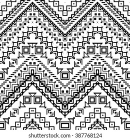 Seamless hand drawn chevron pattern with aztec ethnic and tribal ornaments. Vector black and white boho fashion illustration