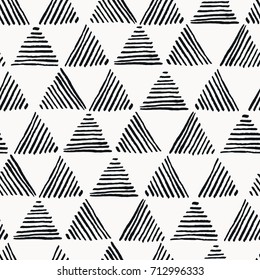 Seamless hand drawn geometric pattern with striped triangles