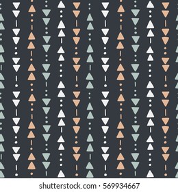 Seamless hand drawn geometric tribal pattern with triangles and dots. Vector navajo design.
