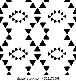 Seamless hand drawn geometric tribal pattern with rhombuses and triangles. Vector navajo design.