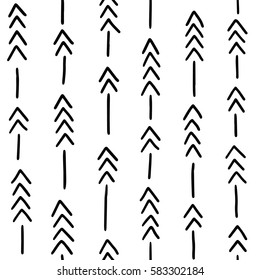 Seamless hand drawn geometric tribal pattern with arrows. Vector navajo design.