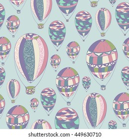 Seamless hand drawn pattern with aerostat elements. Ornamental air balloon design. Light cool shades. Usable for wrapping, textile.