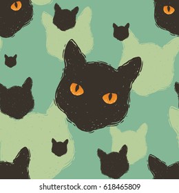 Seamless hand drawn pattern with cat heads