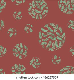 Seamless hand drawn print of abstract leaves on branches shaped in circles
