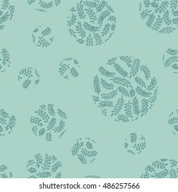 Seamless hand drawn print of abstract leaves on branches shaped in circles