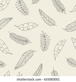 Seamless hand drawn tropical pattern with exotic and palm leaves.