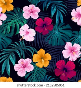 Seamless hand drawn tropical vector pattern with bright hibiscus flowers and exotic palm leaves on dark background.