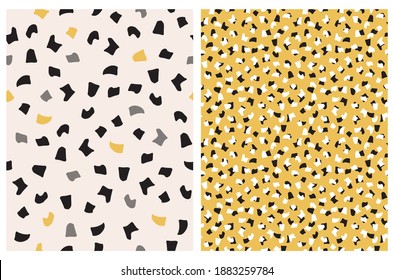 Seamless Hand Drawn Vector Pattern with Yellow, White and Black Irregular Spots Isolated on a Light Dusty Pink and Yellow Background.Cute Abstract Doodle Print. Wild Animal Skin Print.Geometric Print.