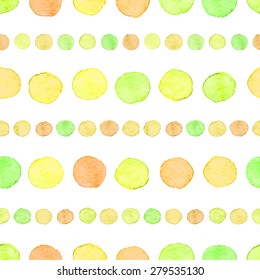 Seamless hand drawn watercolor pattern made of round green, yellow and orange dots, isolated over white.