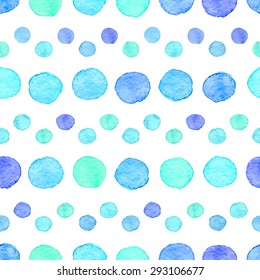 Seamless hand drawn watercolor pattern made of round blue dots, isolated over white.