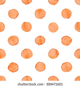 Seamless hand drawn watercolor pattern made of round orange dots, isolated over white.