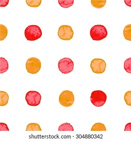 Seamless hand drawn watercolor pattern made of round red and orange dots, isolated over white.