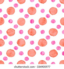 Seamless hand drawn watercolor pattern made of round red and pink dots, isolated over white.