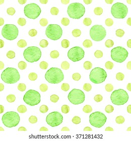 Seamless hand drawn watercolor pattern made of round green dots, isolated over white.