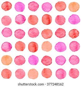 Seamless hand drawn watercolor pattern made of round red and pink dots, isolated over white.
