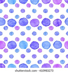 Seamless hand drawn watercolor pattern made of round blue and purple dots, isolated over white.