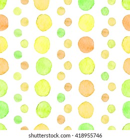 Seamless hand drawn watercolor pattern made of round green, yellow and orange dots, isolated over white.