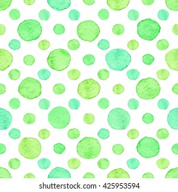 Seamless hand drawn watercolor pattern made of round green dots, isolated over white.