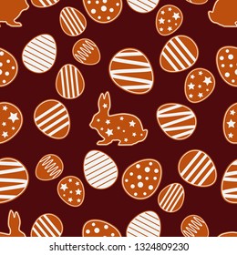 Seamless Happy Easter vector pattern. Figures from gingerbread on a brown background. Festive spring. Can be used for wallpaper, textile, invitation card, wrapping, web page background.
