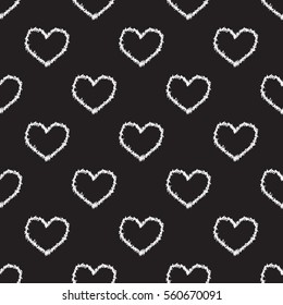 Seamless heart and thorns pattern on black background