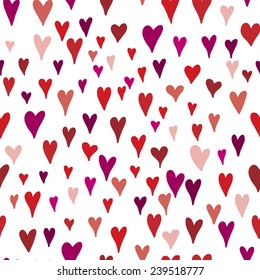 Seamless hearts background in red colors