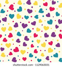 Seamless hearts and dots pattern with beige background. Vector repeating texture. Perfect for printing on fabric or paper.