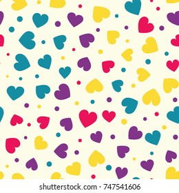 Seamless hearts and dots pattern with beige background. Vector repeating texture.