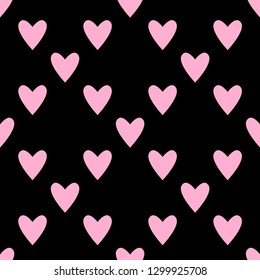 Seamless hearts pattern in pastel pink over black. Valentine's day tile background. Romantic vector pattern.