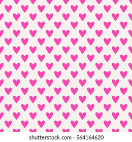 Seamless hearts pattern in pink over white. Valentine's day tile background. Romantic vector pattern.