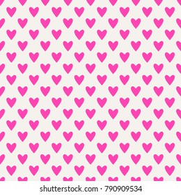 Seamless hearts pattern in pink over white. Valentine's day tile background. Romantic vector pattern.