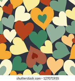 Seamless hearts pattern for valentine's day. Colored doodles on dark blue background.