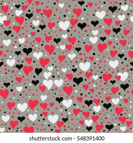 Seamless hearts and polka dots. Points and different sized hearts arranged randomly. Seamless fabric print. Modern cute background in vector. Romantic  background in pink, black, grey.