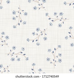 
Seamless herb floral pattern in french blue linen shabby chic style. Hand drawn country bloom texture. Rustic woven background. Kitchen towel home decor swatch. Simple flower motif all over print