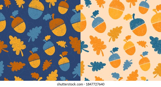 Seamless hygge shaded patterns set with oak leaves and acorns on light and dark backgrounds. Warm yellow, orange, blue colors of elements, autumn theme. Cute hatching. For kids apparel and textile.