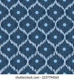 Seamless Ikat ethnic pattern on blue tone. Abstract textured background in tribal,folk embroidery, Aztec chevron art and Mexican style.fabric carpet ornament native textile wallpaper wrapping design.
