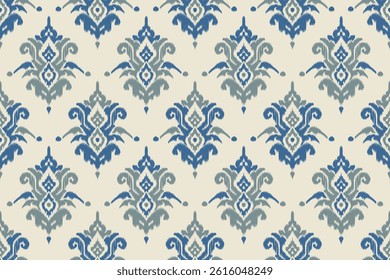 Seamless ikat fabric design with blue and teal ornamental patterns for modern ethnic fabric patterns, fashion prints, interior wallpapers, fabric crafts and traditional wrapping.