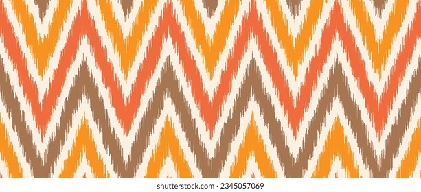 Seamless ikat pattern. Ethnic zigzag chevron repeating background. Ornamental tribal fabric and textile swatch print design. Vector asian folk abstract wallpaper