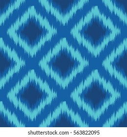 Seamless ikat textile pattern .Geometric abstract shapes . Traditional pattern on the fabric in Asian countries