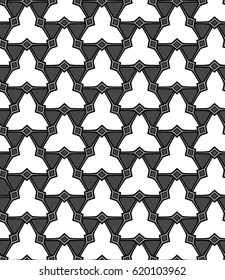 Seamless illustrated geometrical pattern made of triangles in black, grey and white