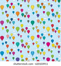 Seamless illustrated pattern made of colorful hot air balloons in the sky with clouds
