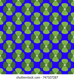 The seamless image of a clover on a blue background. Vector color background.