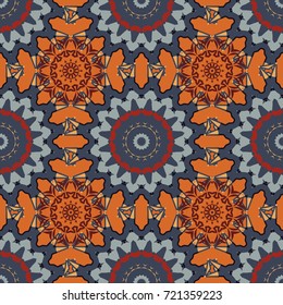 Seamless Indian motif in orange, gray and blue colors. Ornamental floral print on wallpaper, linoleum, textile. Vector pattern with Mandalas, flower paisley.