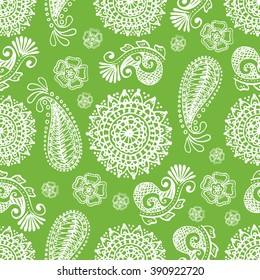 Seamless indian pattern on a green background. Hand drawn doodles. Vector.