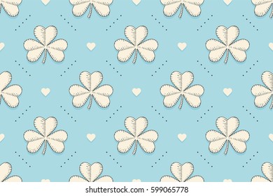 Seamless irish green pattern with clover and heart on blue background. Pattern for St. Patrick Day. Old school hand-drawn design in engraving style for wrapping paper, background. Vector Illustration