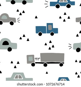 Seamless kids pattern with hand drawn cars. Trendy childish texture for textile, fabric, wrapping, wallpaper. Background vector illustration.