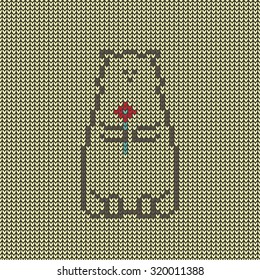 Seamless knitted bear with a flower.