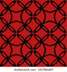 Seamless knitted ornate vector pattern in black and red colors as a fabric texture